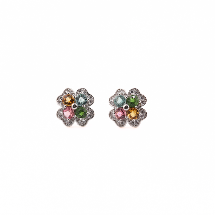 Pair of flower-shaped earrings with Tourmaline gemstones on a white background